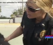 Brunette cop pleasing black dude